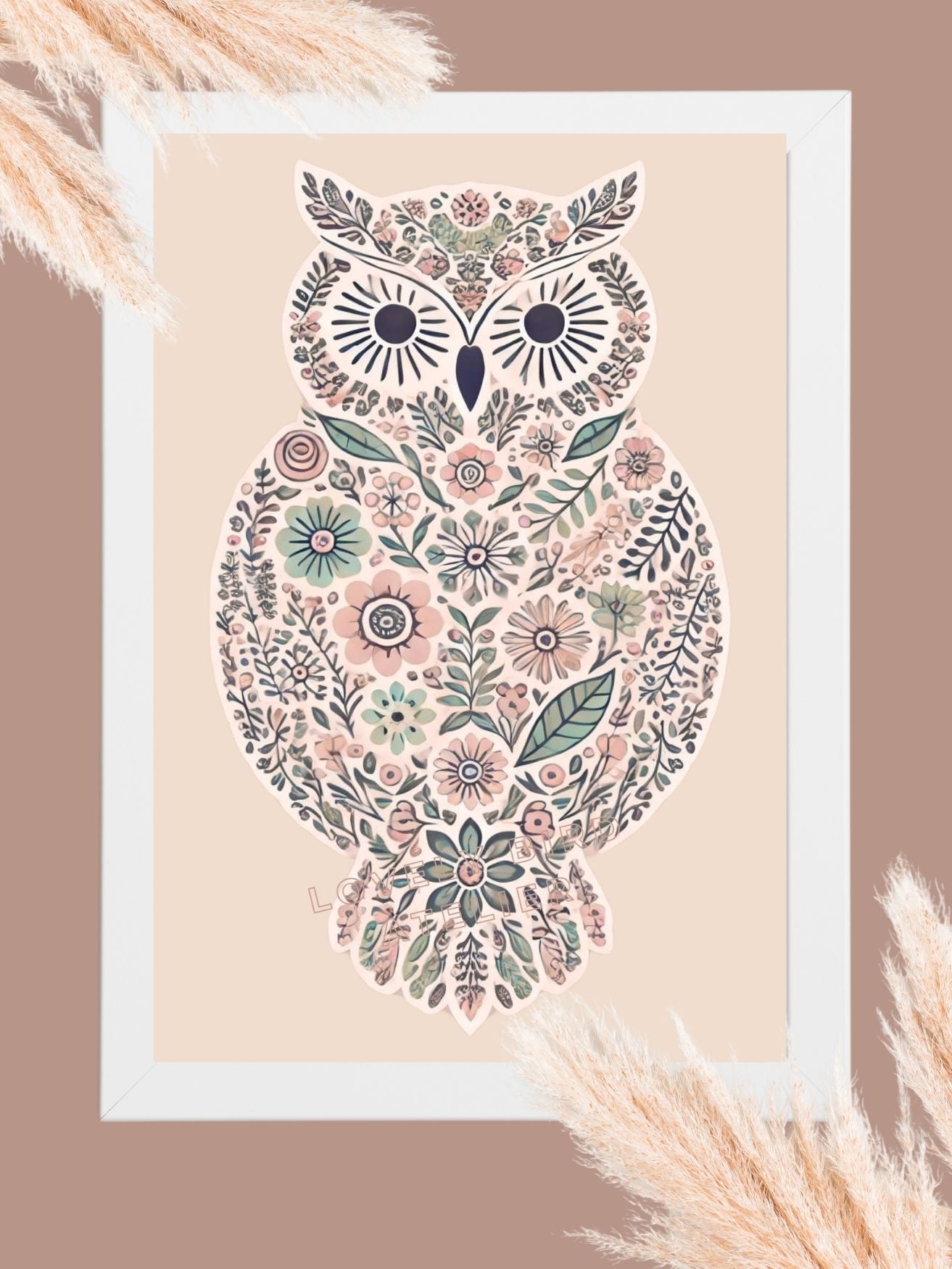 Framed floral owl illustration with intricate botanical patterns on a beige background, surrounded by soft pampas grass.